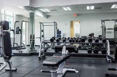 a gym with a lot of equipment in a room at Bright and Cozy 2 Bedroom in Miami
