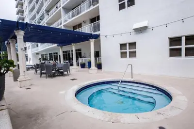a swimming pool in front of a building at Awesome 4BR APT at Brickell in Miami