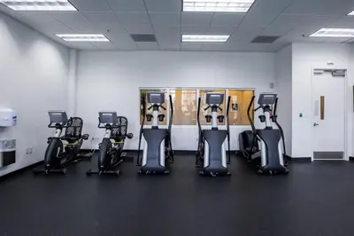 a gym with a row of exercise bikes at SPECTACULAR apt Brickell Miami FREE PARKING in Miami