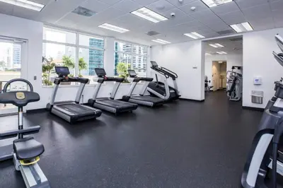 a gym with treadmills and ellipticals in a room at SPECTACULAR apt Brickell Miami FREE PARKING in Miami