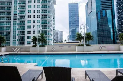 a swimming pool in a city with tall buildings at Lovely 2BR in the Heart of Brickell Free Parking in Miami