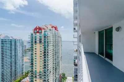 a balcony of a building with a view of the ocean at Lovely 2BR Rental in the Heart of Brickell in Miami