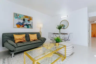 a living room with a couch and a table at Amazing 2BR at Brickell Free Parking in Miami