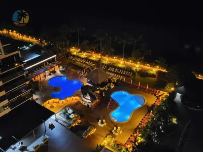 an overhead view of two pools at night at Alexander14192 in Miami Beach