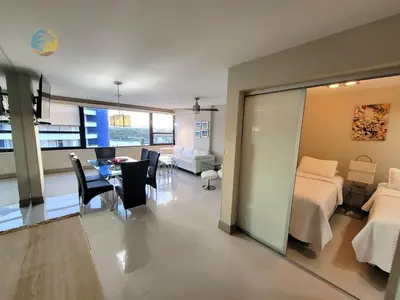 a living room with a bed and a dining room at Alexander14192 in Miami Beach