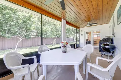 a dining room with a white table and chairs at 4 Mi to Hard Rock Stadium Miramar Home with BBQ! in Miramar