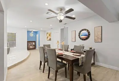a dining room with a table and chairs at Spacious Home With King Bed Near Stadium in Norland