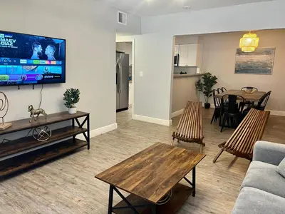 a living room with a couch and a table at Coral Gable 3BR House in Miami