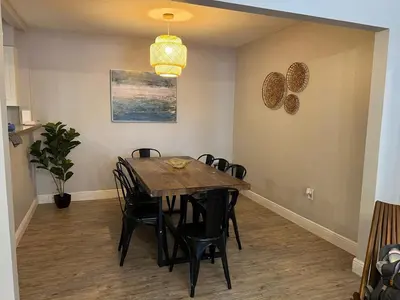 a dining room with a table and chairs at Coral Gable 3BR House in Miami