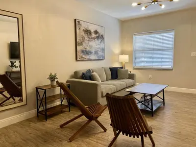 a living room with a couch and a table at Coral Gable 3BR House in Miami