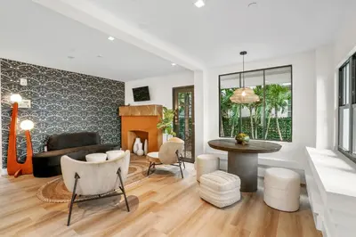 a living room with a couch and a table at The Firefly in Miami Beach