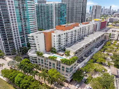 an aerial view of a city with tall buildings at Midtown Muse -Walkable Cozy amenity bldg w parking in Miami
