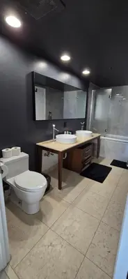 a bathroom with a toilet and a sink and a tub at Miami brickell condo ocean view in Miami