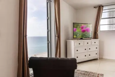 a living room with a view of the ocean at Beachfront 2 BR Apartment full Kitchen- Sian in Hollywood
