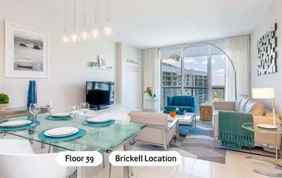 a living room with a table and a couch at MVR-Epic Views - Luxe Location in Miami