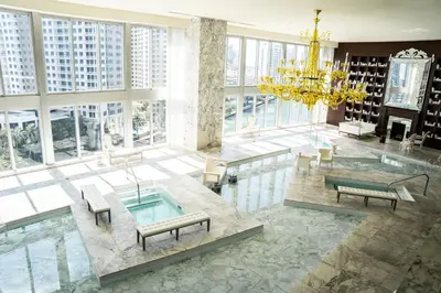 a large room with a chandelier and a pool at MVR-Epic Views - Luxe Location in Miami