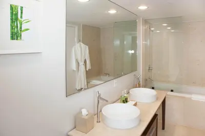 a bathroom with two sinks and a large mirror at MVR-Epic Views - Luxe Location in Miami