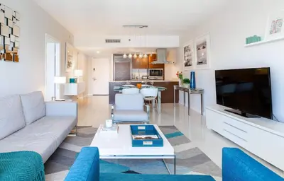 a living room with a couch and a tv at MVR-Epic Views - Luxe Location in Miami