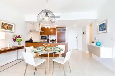 a kitchen and dining room with a table and chairs at MVR-Corner Unit w Epic Views in Miami