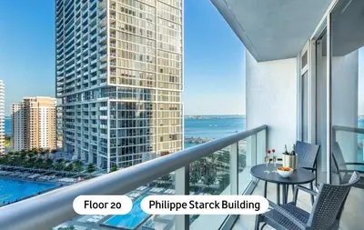 a balcony with a table and a view of a building at MVR-Icon Brickell High-Rise w Balcony in Miami