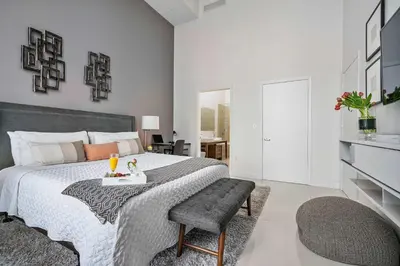 a bedroom with a bed and a table and chairs at MVR-Water Views & Modern Luxury in Miami