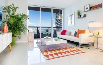 a living room with a couch and a table at MVR - Where Views Meet Vibes in Miami in Miami
