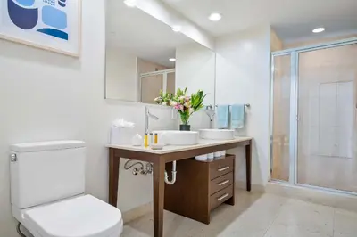 a bathroom with a toilet and a sink and a shower at MVR - Designer Condo in Prime Brickell in Miami