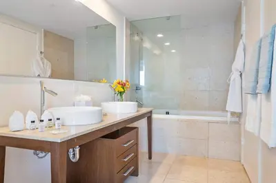 a bathroom with two sinks and a tub at MVR - Icon Brickel River & Bay Views in Miami