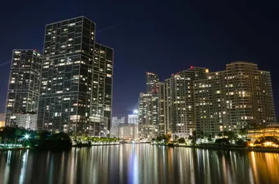 a city skyline with tall buildings at night at MVR - Lux Studio Balcony Pool Access & City Views in Miami