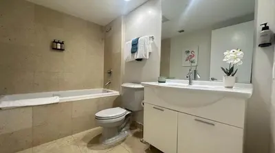 a bathroom with a sink and a toilet and a bath tub at MVR - Lux Studio Balcony Pool Access & City Views in Miami