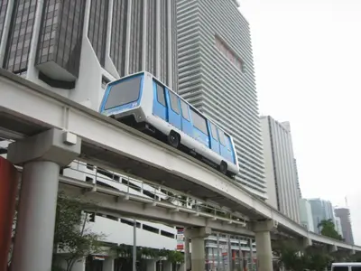 a bus on top of a bridge in a city at MVR - Stylish Escape in Icon Brickell in Miami