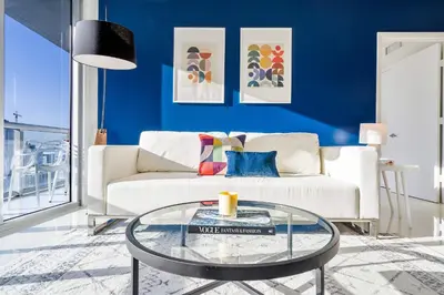 a living room with a white couch and a glass table at MVR - High-End Condo with Miami Views in Miami
