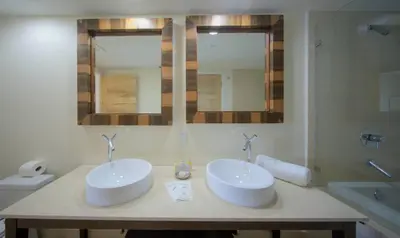 a bathroom with two white sinks and a shower at MVR Balcony Bliss in Miami in Miami