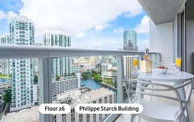 a balcony with a table and a view of a city at MVR - Best Views in Brickell in Miami