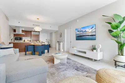 a living room with a couch and a table at MVR - Wake Up to Brickell-s Best Views in Miami