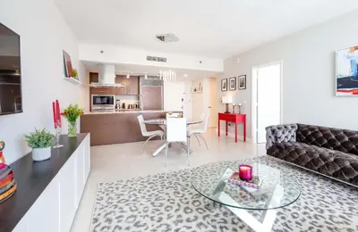 a living room with a couch and a table at MVR Bright & Airy Condo with Views in Miami