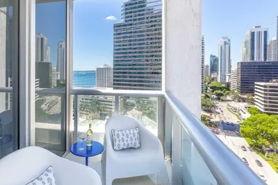 an apartment balcony with a view of the city at MVR - High-Floor Luxury with Iconic Views in Miami