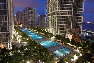 a row of pools in a city at night at MVR - Sky-High Style in Brickell in Miami