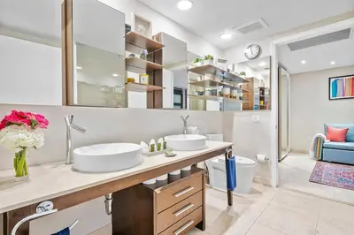 a bathroom with two sinks and a toilet at MVR - Designer Stay in Sky-High Tower in Miami