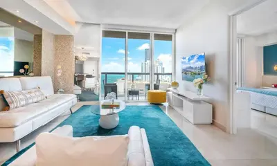 a living room with a white couch and a table at MVR - Designer Stay in Sky-High Tower in Miami