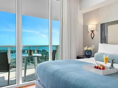 a bedroom with a bed with a view of the ocean at MVR-The Stay You-ll Talk About All Year in Miami