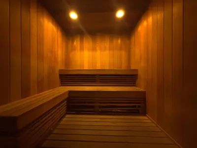 a sauna with wood paneling and two lights on at MVR - Grove-s Best Stay Near Everything You Want in Miami