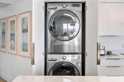 a washer and dryer stacked in a kitchen at MVR-No More Hassles-Just Peace & Luxury in Miami