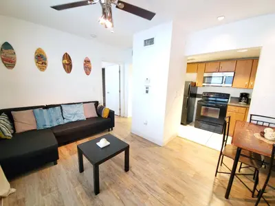 a living room with a couch and a table at 1 Bed on Collins Av close to Beach in Miami Beach