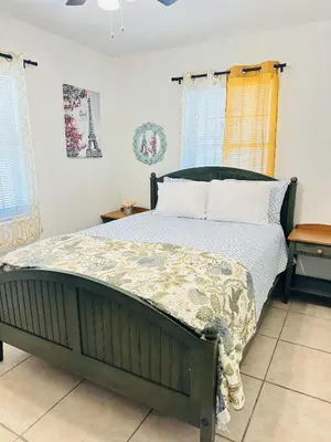 a bedroom with a large bed in a room at Miami Casa II in Miami Gardens