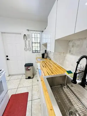 a kitchen with a sink and a counter top at Miami Casa II in Miami Gardens