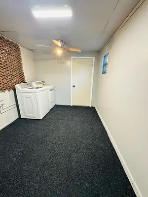 an empty room with a washer and dryer in it at Miami Casa II in Miami Gardens