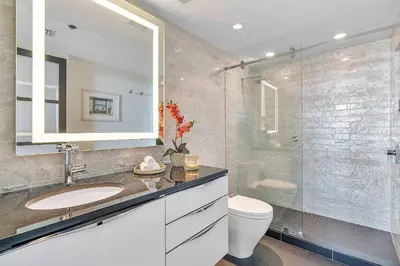 a bathroom with a sink and a shower at MVR-Bask in Luxury-Right in Coconut Grove in Miami