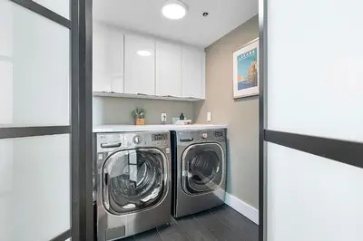 a laundry room with a washer and dryer at MVR - Elevate Your Stay with Panoramic Bay Views in Miami