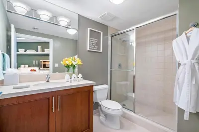 a bathroom with a toilet and a shower and a sink at MVR-See the City Sparkle-Every Night in Miami